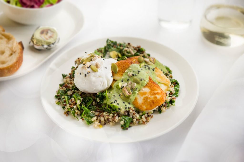 Poached eggs with kale quinoa grilled haloumi pistachios seeds and herbed tahini dressing Business breakfast menu ex PERLHR B787 QF9 preview