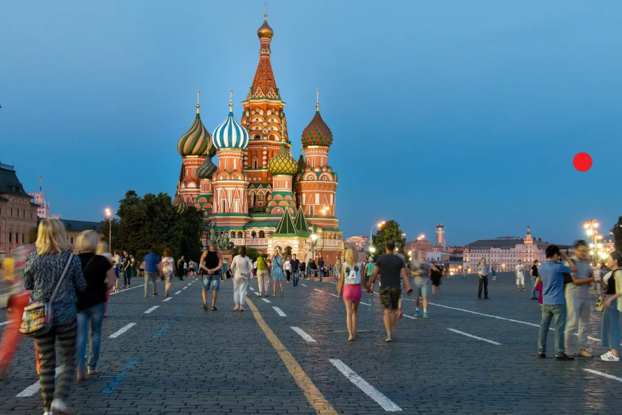 Which Airlines Fly To Russia In 2026? The 60 Foreign Carriers Still Operating Russia Flights 4 People walking on Red Square in front of Saint Basil’s Cathedral at dusk in Moscow